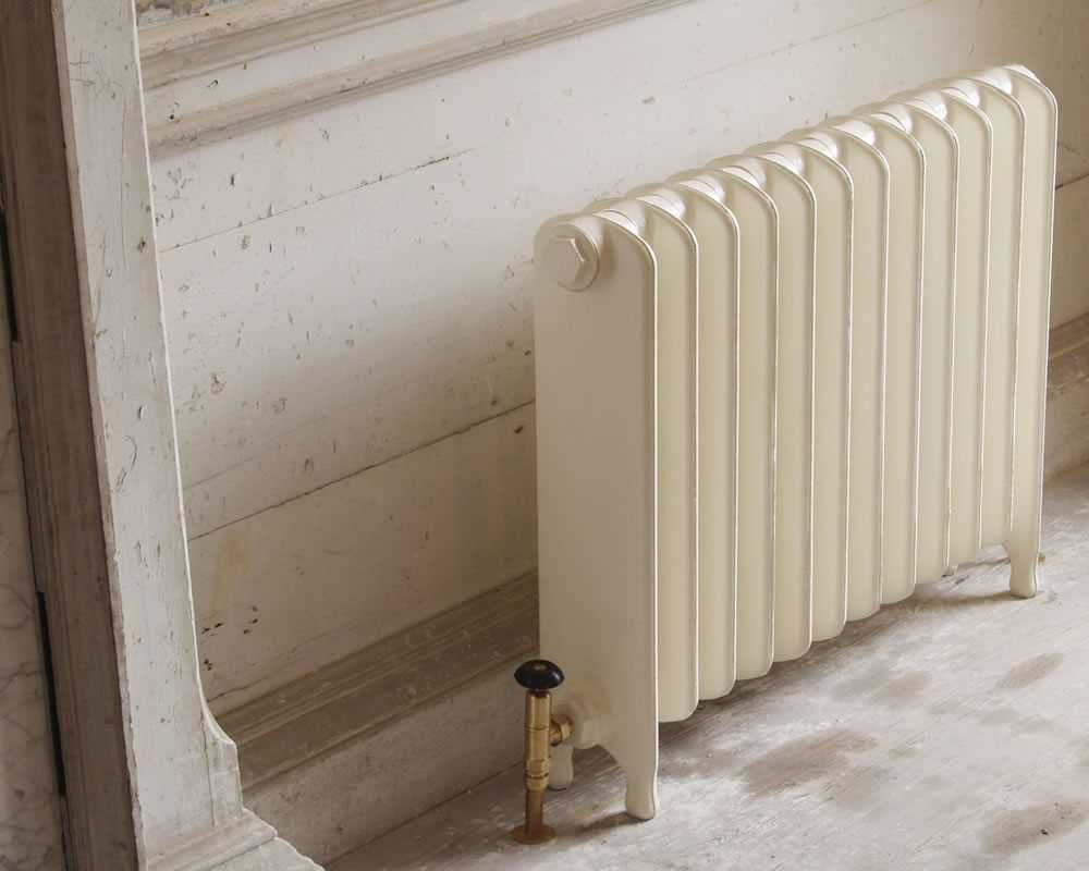 Eton 1 column cast iron radiator painted in buttermilk with brass valve